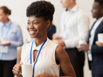 Female wearing RFID conference badge and lanyard