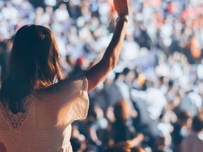 Music festival with woman wearing wristband